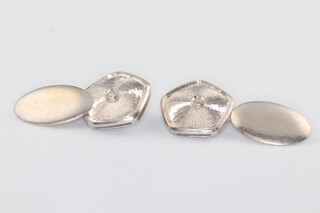 A pair of white metal 750 diamond set cufflinks 6.5 grams