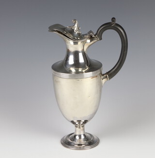 An Edwardian Adam style silver hot water jug with ebony mounts, Sheffield 1902, 27cm, gross weight 514grams 