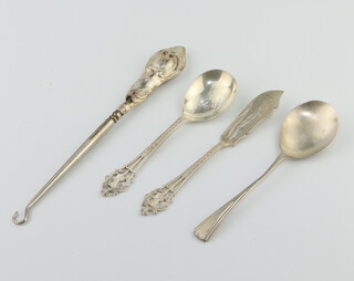 A silver spoon with pierced handle Edinburgh 1979, a knife, spoon and button hook 51.8 grams 