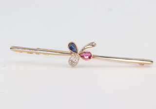 An Edwardian yellow metal 15ct diamond, ruby and sapphire leaf brooch 5.5cm, 3.4 grams 