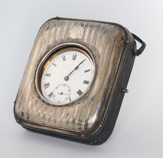 A 19th Century gunmetal mechanical pocket watch contained in a engine turned silver case, rubbed marks