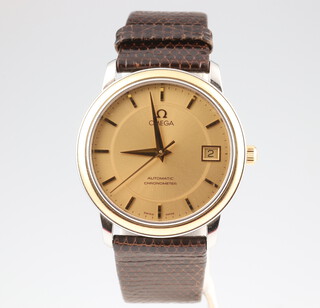 A gentleman's steel and gilt cased Omega calendar automatic chronometer wristwatch contained in a 34mm case, on a brown leather strap, complete with box  