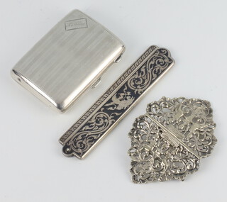 An engine turned silver cigarette case, a Thai niello comb holder and a white metal buckle 120 grams 