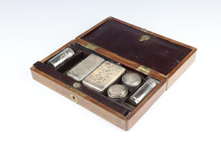 A Victorian mahogany toilet box containing 4 silver plated mounted jars and accessories 