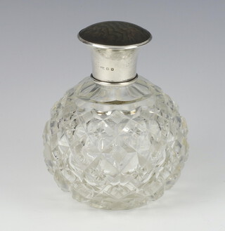 An Edwardian style silver and tortoiseshell lidded glass toilet bottle 12cm, rubbed marks  
