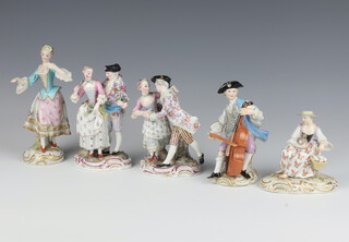 A pair of Meissen figures of ladies and gentleman raised on a Rococo bases 13cm (1 a/f), a seated lady with a chicken and eggs 9cm (chipped), a standing lady (restored) 15cm and a musician 11cm (restored) 