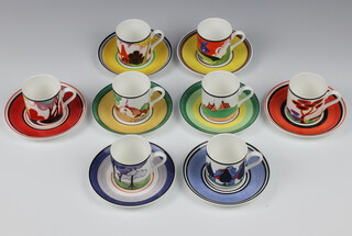 A set of 8 Wedgwood Clarice Cliff Cafe Chic coffee cans and saucers - Windmill, Brookfields, Secrets, Summer House, Autumn, Red Tree, Blue Firs and May Avenue, boxed 