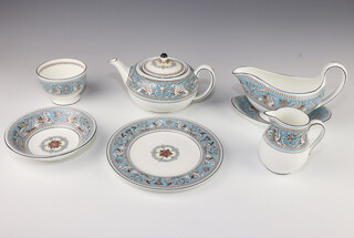A Wedgwood Florentine tea set and part dinner service comprising tea pot, milk jug, sugar bowl, 8 cups and saucers, 8 tea plates, a sandwich plate, sauce boat and stand, 6 side plates, 2 breakfast plates, 8 dinner plates and 8 dessert bowls