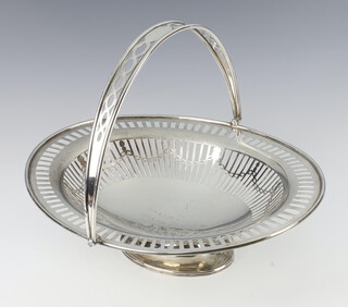 A silver swing handle basket with pierced decoration and presentation inscription Sheffield 1922, 778 grams, 33cm 