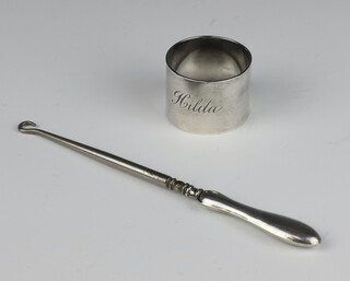 A silver napkin ring together with a silver mounted button hook, London 1942