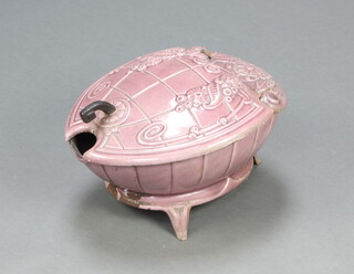 A Victorian cast iron and pink enamelled oval shaped coal scuttle with hinged lid decorated a stylised cornucopia, raised on panel supports 22cm h x 48cm w x 38cm d 