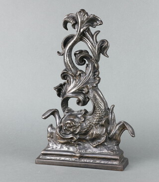 A cast iron door stop in the form of a dolphin 39cm x 24cm x 6cm 