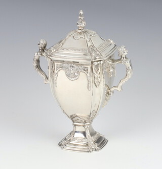 A cast silver trophy cup and cover with caryatid handles and cast mask detail, London 1936, 15cm, maker William Comyns & Sons Ltd. 438 grams 