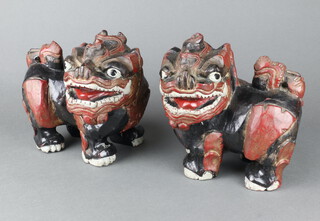 A pair of 19th/20th Century painted carved wooden figures of standing Dogs of Fo 22cm x 24cm x 12cm 