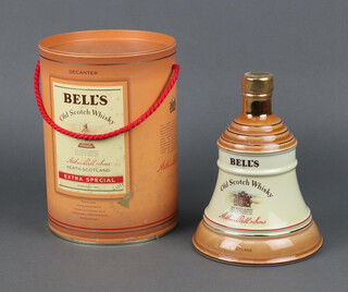 A 70cl Wade bell shaped decanter of Bells whisky 