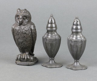 A pair of Adam style pewter pepperettes, the base marked Astor by Poole 11cm h x 4cm, together with a spelter figure of a seated owl 11cm  