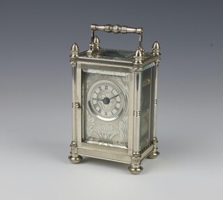 A Mappin & Webb silver carriage clock with striking and fusee movement, profusely engraved with flowers, feathers and scrolls, the dial with Roman numerals above a basket of flowers with column supports and engraved scroll floral door, the back plate engraved and numbered 106 of 200, 18cm to handle, raised on a turned feet, contained in a fitted case with key, together with 2 spare bevelled glass panels