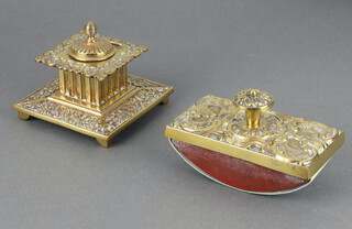A Victorian embossed brass desk blotter 7cm x 12cm x 6.5cm, a square brass inkwell with hinged lid and china liner 5cm x 10cm x 10cm, 