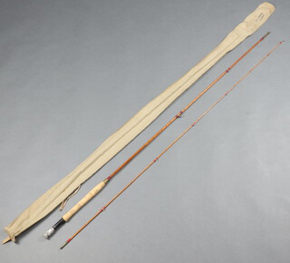 A Hardy Perfection split cane 9', 2 piece fly fishing rod, contained in a green cloth bag 