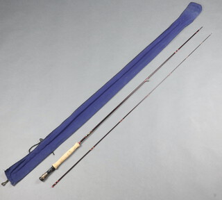 A Hardy graphite deluxe 9', 2 piece trout fishing rod with 6/7 line weight in a blue bag 