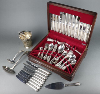 A canteen of silver plated cutlery with fancy handles for 8 (101), an ice bucket and set of teaspoons in a mahogany canteen, maker George Butler & Co., all stamped A1 