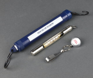 A Hardy Bros chrome cased thermometer, ditto line snip on retractor and a ditto spring balance