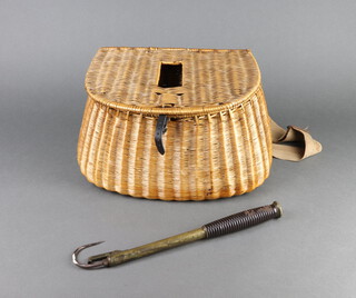 A brass 3 draw fishing gaff, a loop reel etc, all contained in a basketwork pot bellied fishing creel 