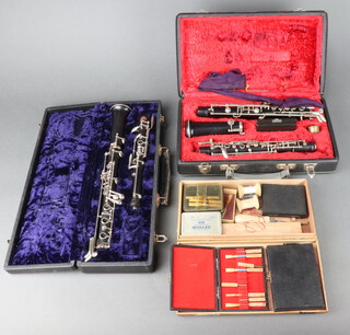 A, F Buisson of Dallas oboe together with a Czech Amati, cased and various reeds  