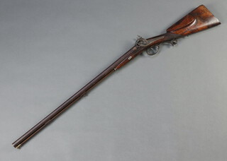 GEBR Lindenschmit of Mainz Germany, a handsome 19th Century double barrelled muzzleloading fouling sporting shotgun with 72cm chiseled gothic column barrels, inlaid gilt, the side locks signed by Lindenschmit, decorated wild boar and deer, having dolphin hammers and a walnut stock 