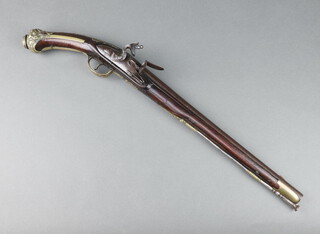 An 18th Century flintlock holster pistol with 40cm barrel and brass embellishments