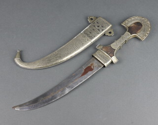 A jambuka with 24cm blade, contained in an engraved metal scabbard 