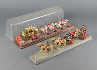 The Crescent Toy Company, a 1977 Queen's Silver Jubilee model of The State Coach, contained in a plastic case 10cm h x 36cm w x 9cm d (split to lid), together with a ditto model of The 1902 State Landau for the 1977 Silver Jubilee (case missing) 