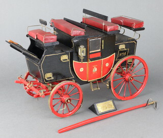 A wooden scratch built model of The London to York mail coach 25cm h x 39cm w x 20cm d 