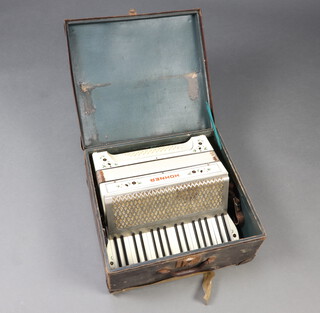 Hohner, an accordion with 48 buttons and complete carrying case 