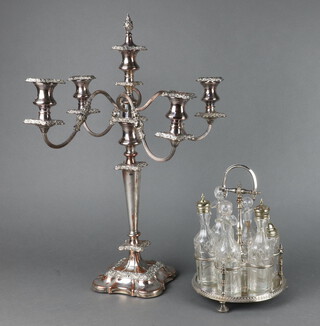 A silver plated on copper 5 light candelabrum 49cm together with a plated 6 bottle cruet stand 
