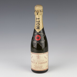 A half bottle of 1953 Moet and Chandon champagne (some evaporation) 