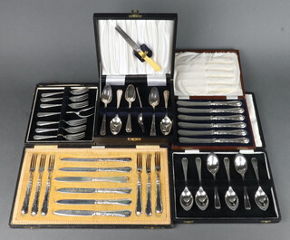 A cased set of silver plated dessert eaters for 6, 4 other cased sets
