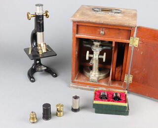 W Watson of London, a Myral No.42393 student's single pillar microscope with various lenses and a Bausch and Lomb No.36033 boxed 