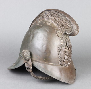 A 19th Century brass Fireman's helmet with leather liner and chin strap 