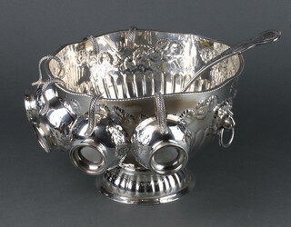 A silver plated repousse punch bowl with lion ring handles, 6 cups and a ladle 