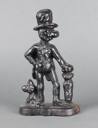 A Victorian style cast iron door stop in the form of a standing figure with umbrella and dog 25cm x 15cm x 5cm 