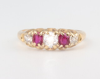 A yellow metal Victorian diamond and ruby ring, the centre diamond 0.3ct, 3.6 grams, size O 