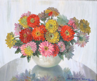 Macdonald Bruce, oil on board signed, still life study of a vase of flowers on a table 50cm x 60cm 