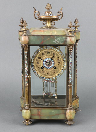 A 19th Century French 8 day four glass clock of shaped outline, the 8cm gilt dial with roundels and Arabic numerals, having a twin mercurial pendulum, contained in an onyx and champleve enamelled case surmounted by a lidded urn, striking on gong, complete with pendulum and key 37cm h x 20cm w x 13cm d 
