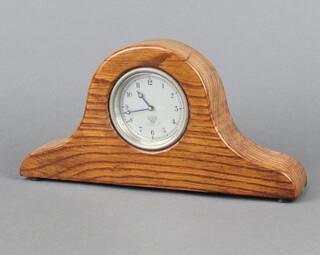 A Smiths car clock, the 7cm dial with Roman numerals marked Smiths P-295.864, contained in an oak Admiral's hat shaped case 15cm h x 31cm w x 5cm d 