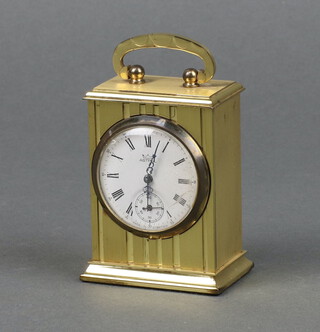 Astral, a travelling clock, the 4cm enamelled dial with Roman numerals and subsidiary second hand, contained in a gilt metal case 8cm x 6cm x 4cm  