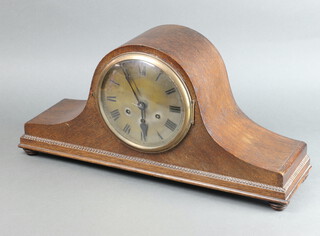A 1920's chiming mantel clock with silvered dial and Roman numerals, contained in an oak Admiral's hat shaped case 28cm h x 56cm w x 15cm d, complete with pendulum and key 
