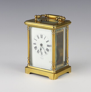 A 20th Century French 8 day carriage timepiece, the enamelled dial with Roman numerals, marked Selfridge London, contained in a gilt metal case, with key 11cm x 8cm x 6cm 