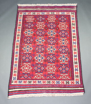 A red, white and blue flat ground Kilim rug with all over geometric design 214cm x 139cm  