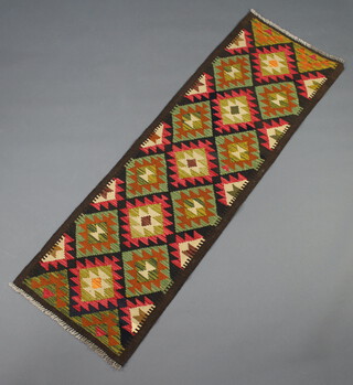 A brown, red and blue ground Maimana Kilim runner decorated diamonds 193cm x 62cm 
